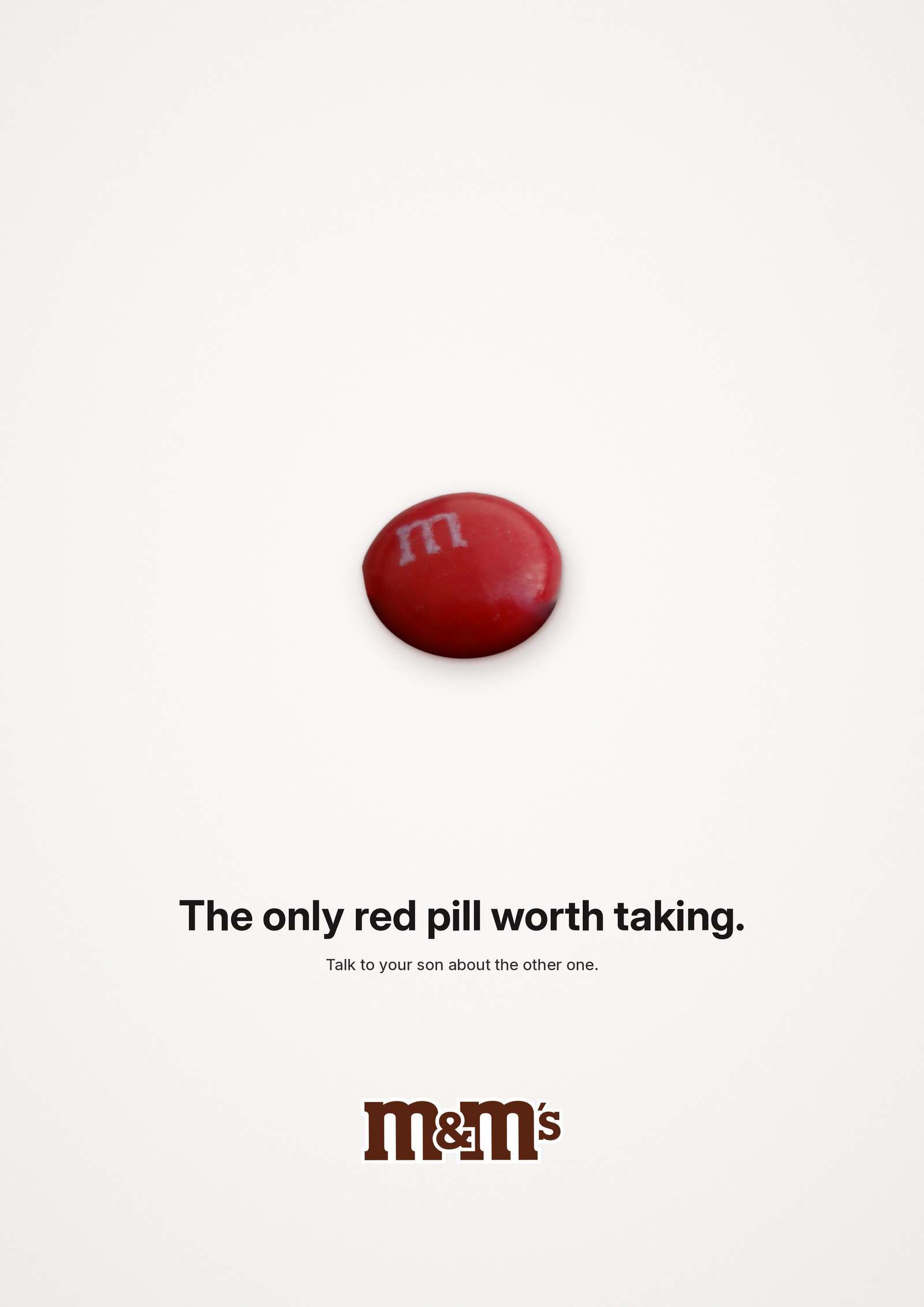 M&M's poster: a single red M&M centred on white, headline The only red pill worth taking