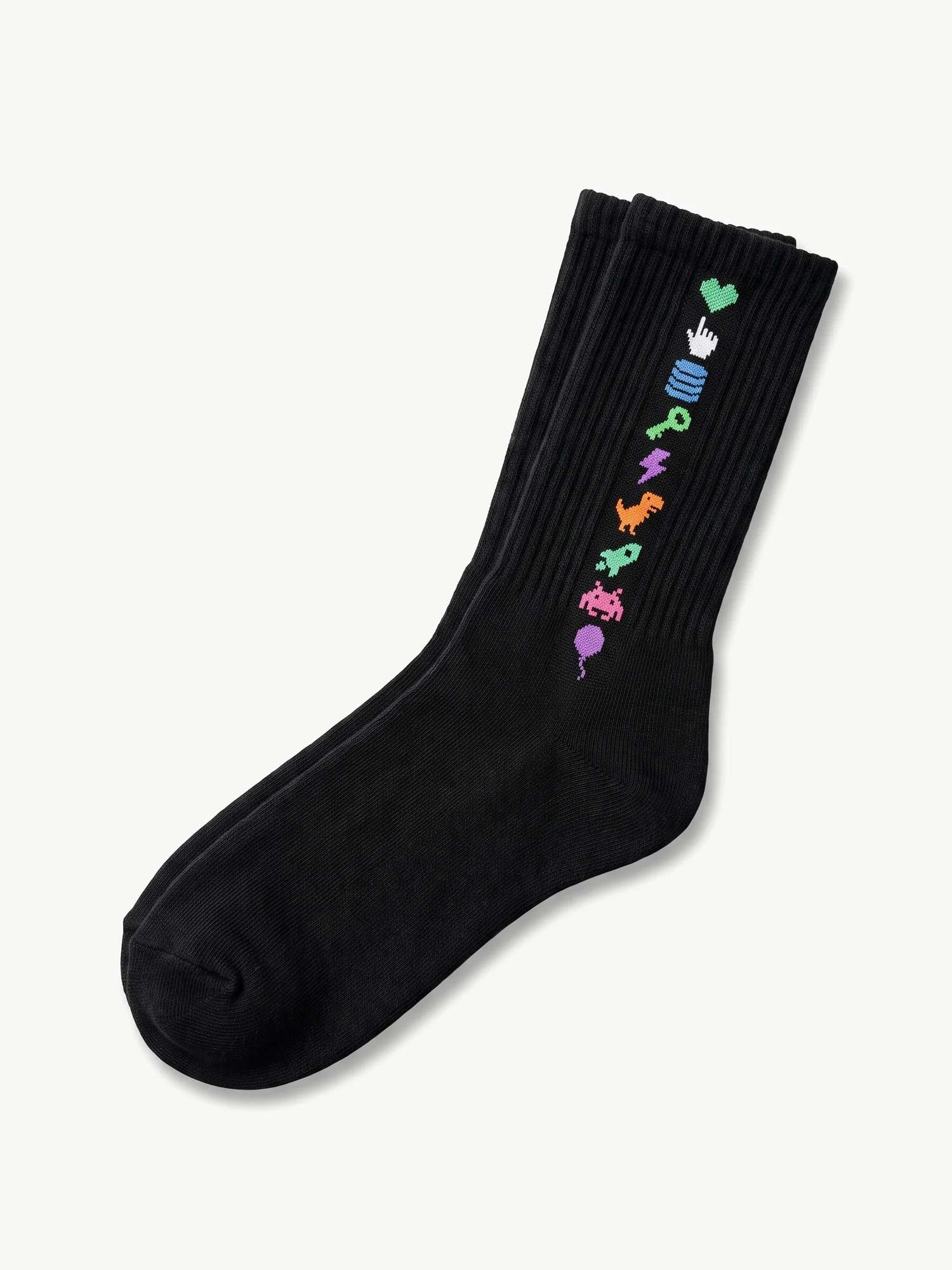 A black crew sock with a vertical stack of pixel icons up the cuff, a heart, a cursor, a database, a key, a bolt, a dinosaur, a rocket, an invader and a balloon