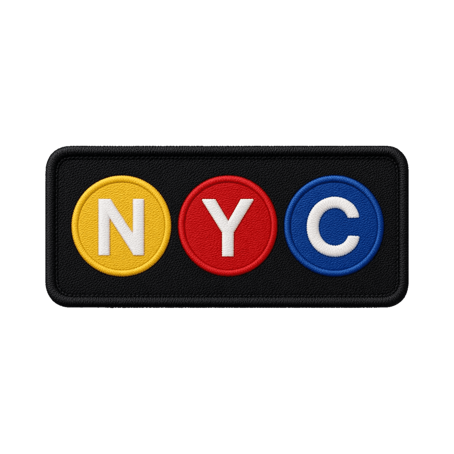 A black rectangular patch with NYC spelled out in yellow, red and blue subway-style circles